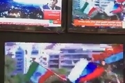 برافراشته شدن پرچم های سوریه، روسیه و ایران توسط مردم سوریه