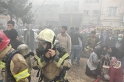 آتش‌سوزى در برج مسکونى 15 طبقه در تهران/ آتش نشانان 100 نفر را نجات دادند/  سیستم اطفا حریق عمل نکرد + عکس