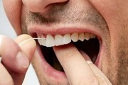 چه زمانی باید از نخ دندان استفاده کنیم؟

