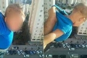 بازداشت مردی الجزایری که فرزندش را از پنجره آویزان کرد