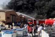 آتش سوزی بزرگ در بزرگترین انبار صندوق های آرای انتخابات پارلمانی عراق در بغداد+عکس